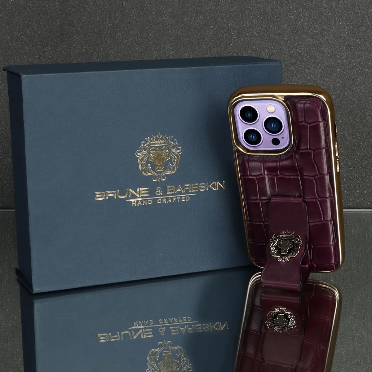 Purple iPhone Series Mobile Cover Golden Rim Finger strap cum Stand Croco Print Leather with Metal Lion Logo by Brune & Bareskin